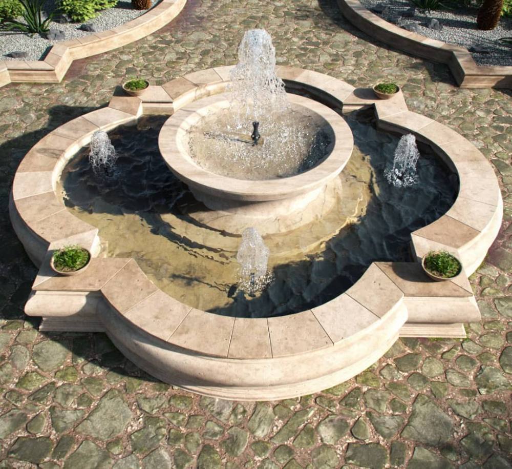 Custom stone water fountain on cobbled paving